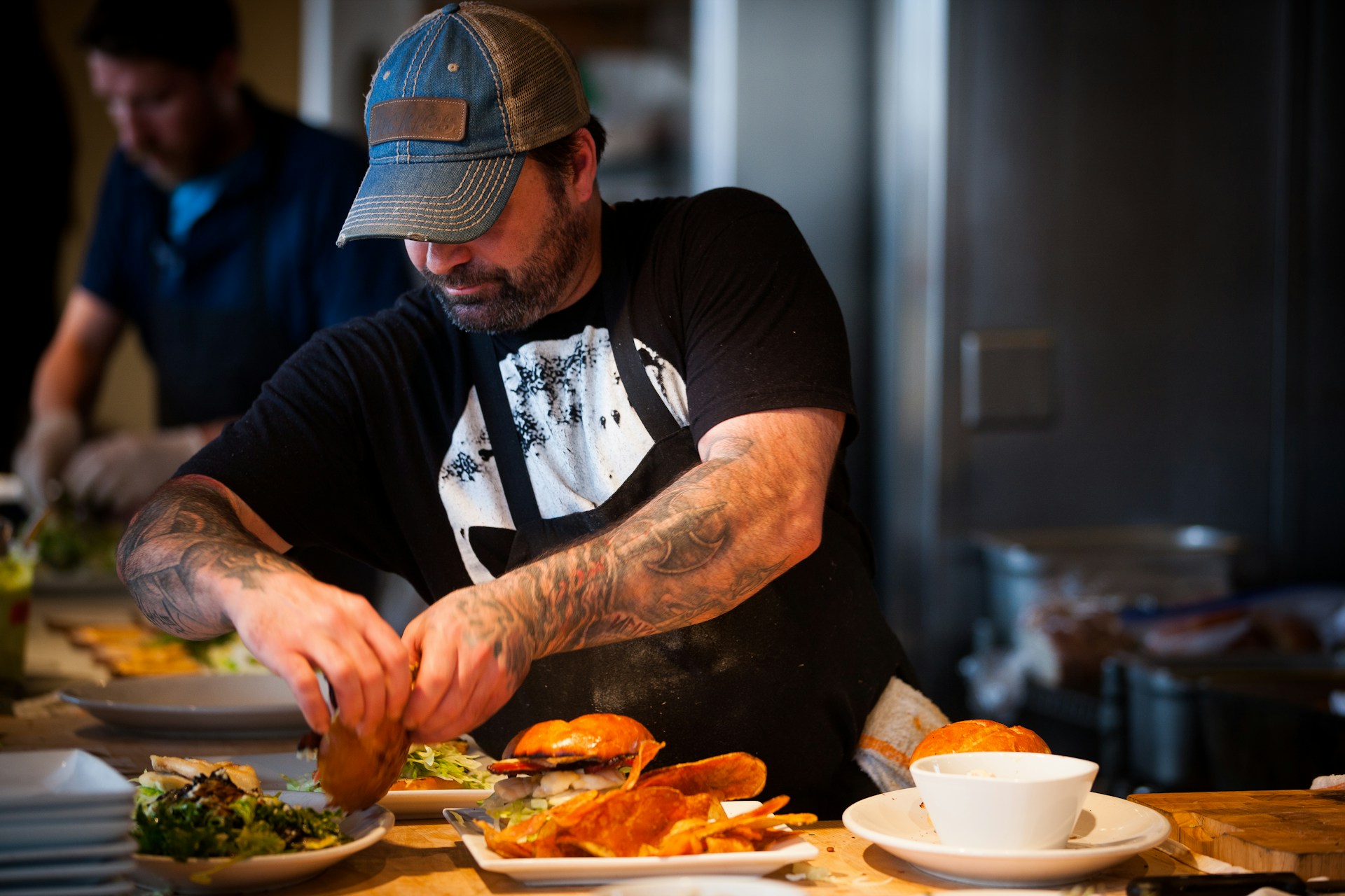 a line cook or chef prepares a dish in a restaurant.